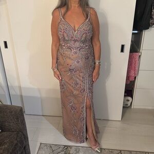 Fully lined beaded gown.